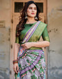 Ivory and Green Tussar Silk Saree with Elephant Motifs and Intricate Zari Border