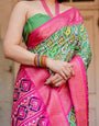 Green and Pink Tussar Silk Saree with Vibrant Ikat Patterns and Zari Border